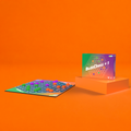 uttChess +1 box and colourful three-player game board displayed against a bright orange background, replayable abstract strategy game for family game nights