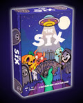 The Six 2–6 player card game by Play It Now displayed in its colourful box, featuring spooky Halloween-style characters, a UFO and a hand of cards on the cover. A fast-paced, easy-to-learn game for all ages, perfectly matching Ralbru’s travel game ideology with its travel-friendly format, ideal for holidays, family game nights, parties and playing with friends.